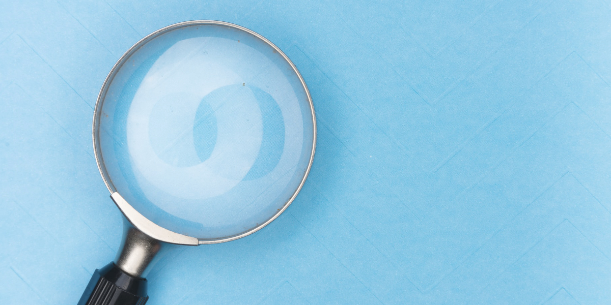 Magnify glass on a blue background